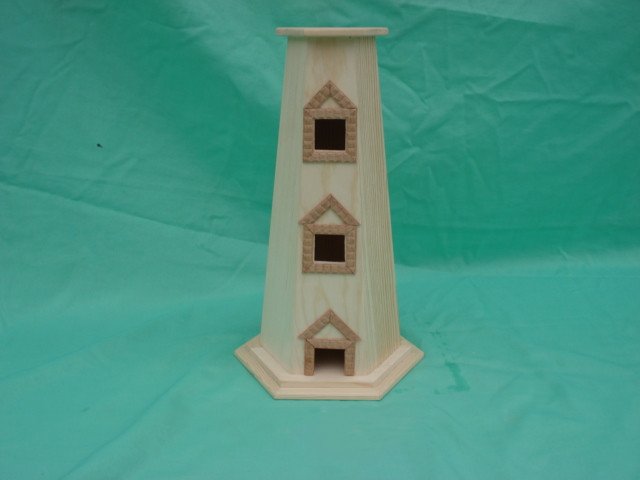 Tall obelisk-style hexagonal wooden bird feeder with three-tier peaked roofs and square entrance openings