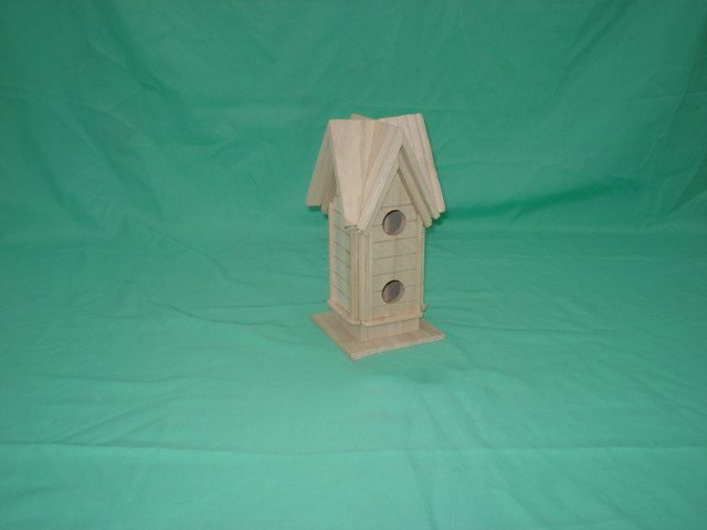 Twin A-frame wooden bird house with double-pitched roof and two circular entrance holes
