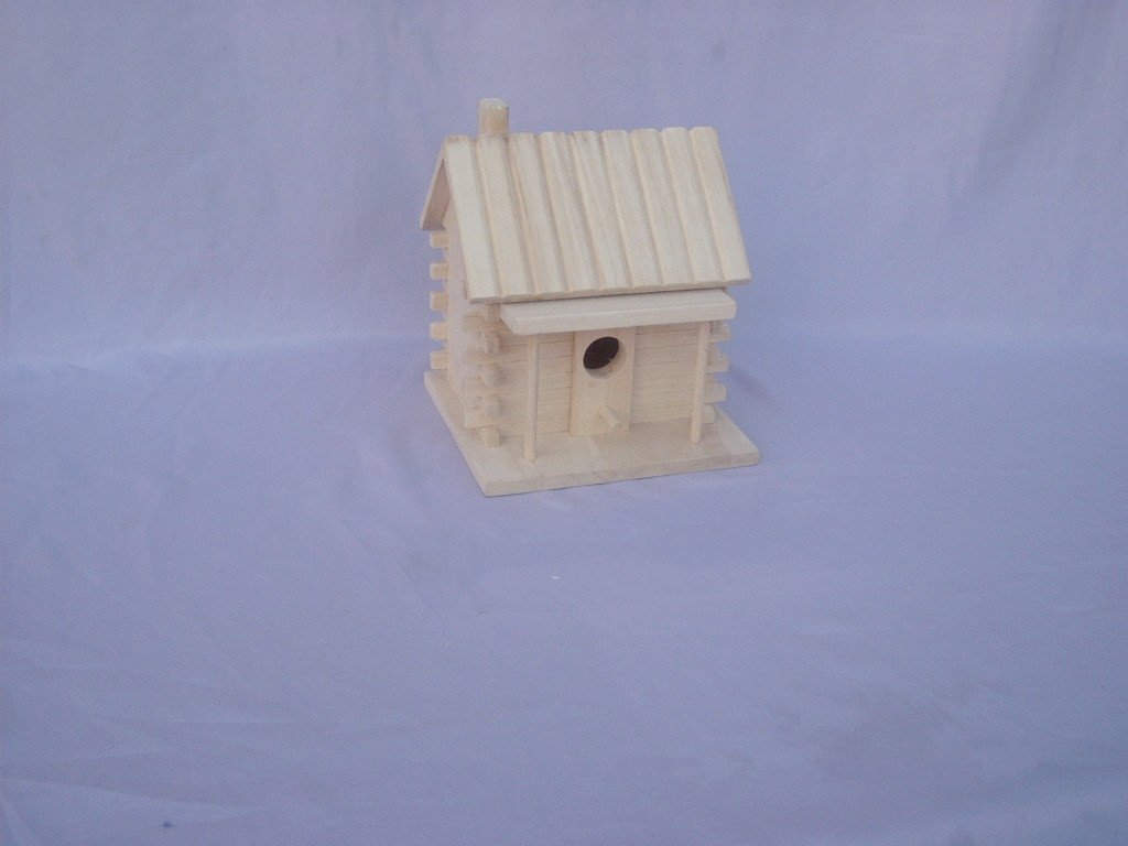 Log cabin style wooden bird house with log walls, board-and-batten roof, chimney and round entrance