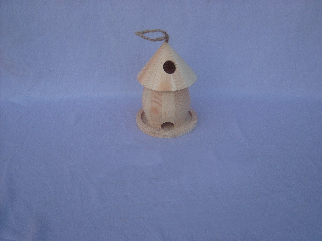 Round wooden bird house with cone roof, rope hanger, round entrance and bottom arched opening