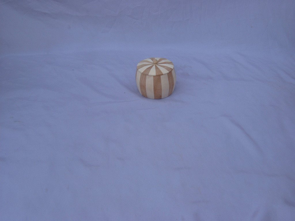 Small round pumpkin-shaped wooden box with vertical two-tone stripe pattern and ridged lid