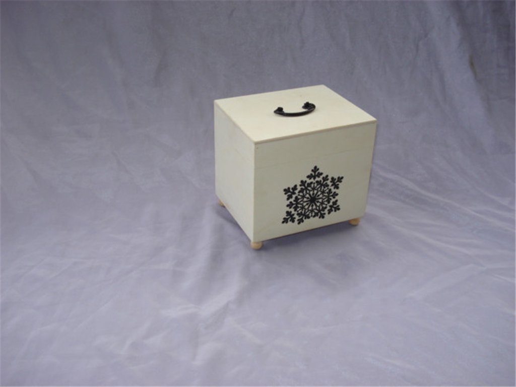 Square cream-white wooden box with snowflake cutout, black top handle and small feet