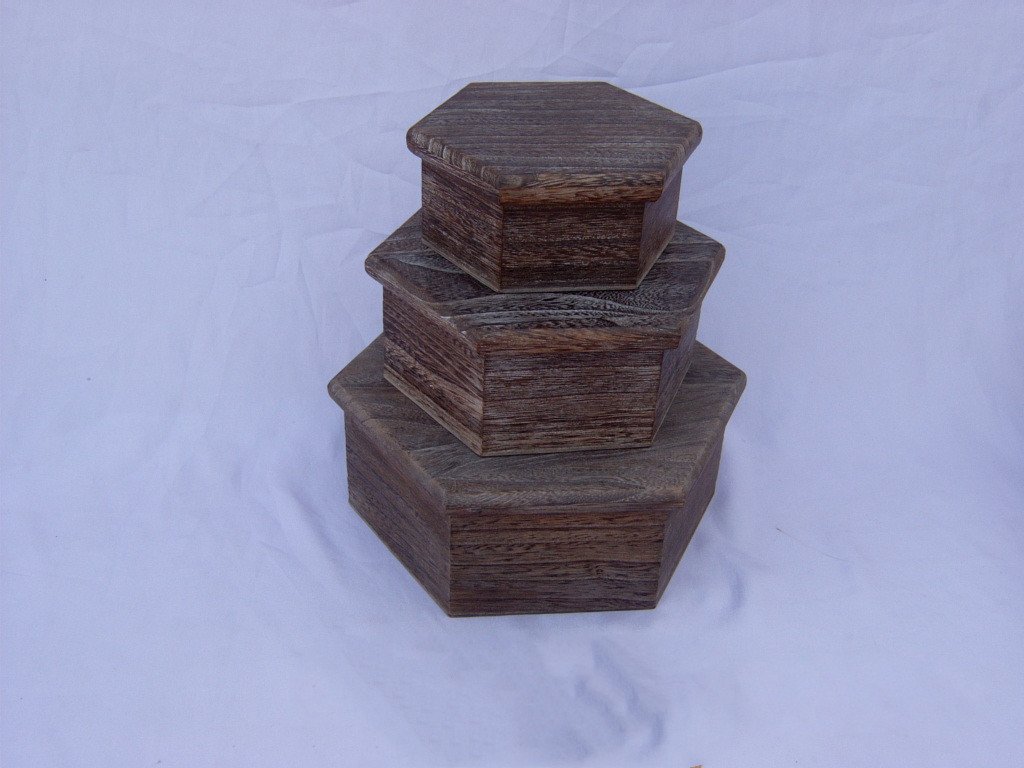 Three-tier hexagonal stepped wooden box in dark burnt wood finish, unfinished look