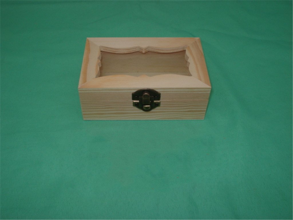 Open rectangular wooden box with curved scalloped interior dividers and brass latch on side