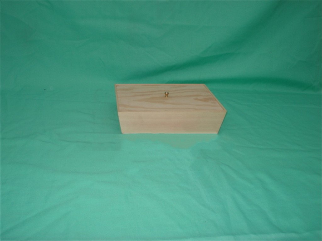 Long flat natural-pine wooden box with small round brass knob, no visible latch