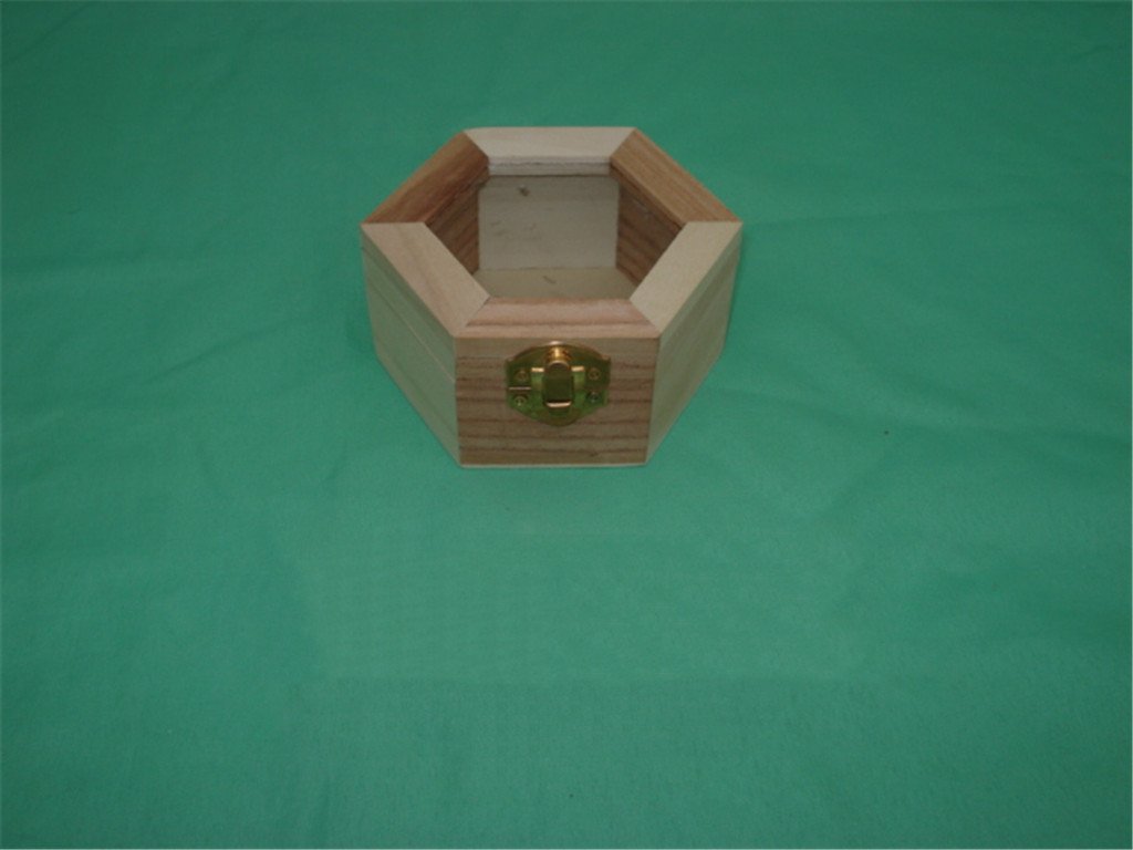 Hexagonal natural-pine wooden jewelry box with internal divider panels and brass latch