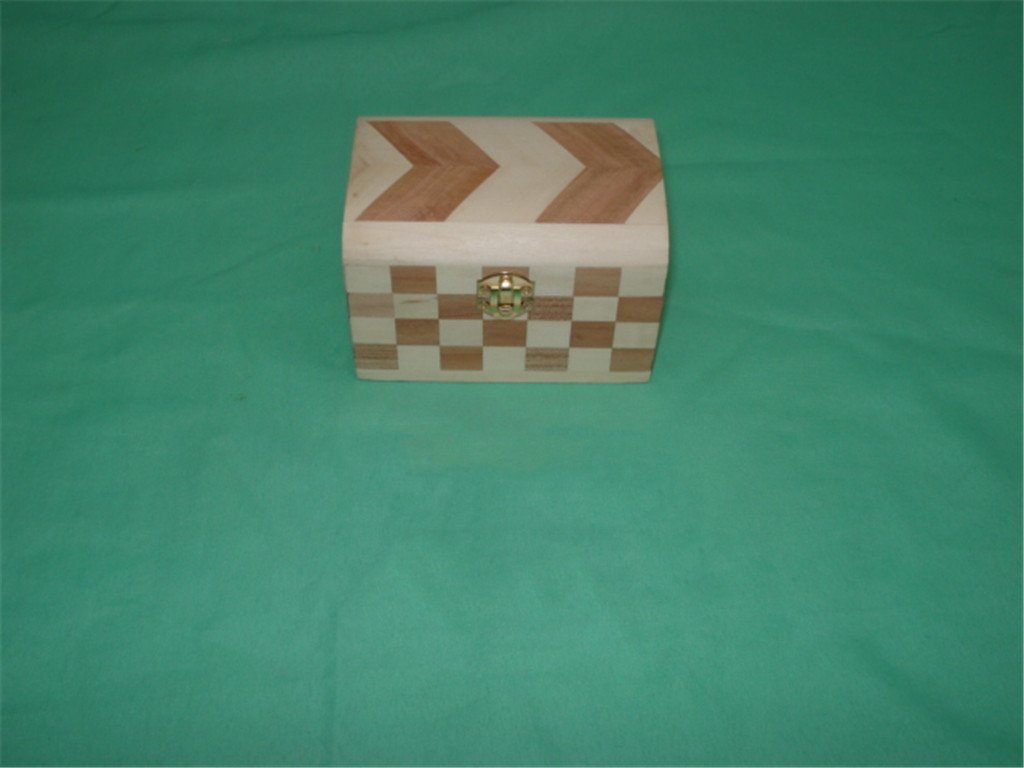 Small rectangular wooden box with chevron arrow pattern on lid and checkered side panels, brass latch