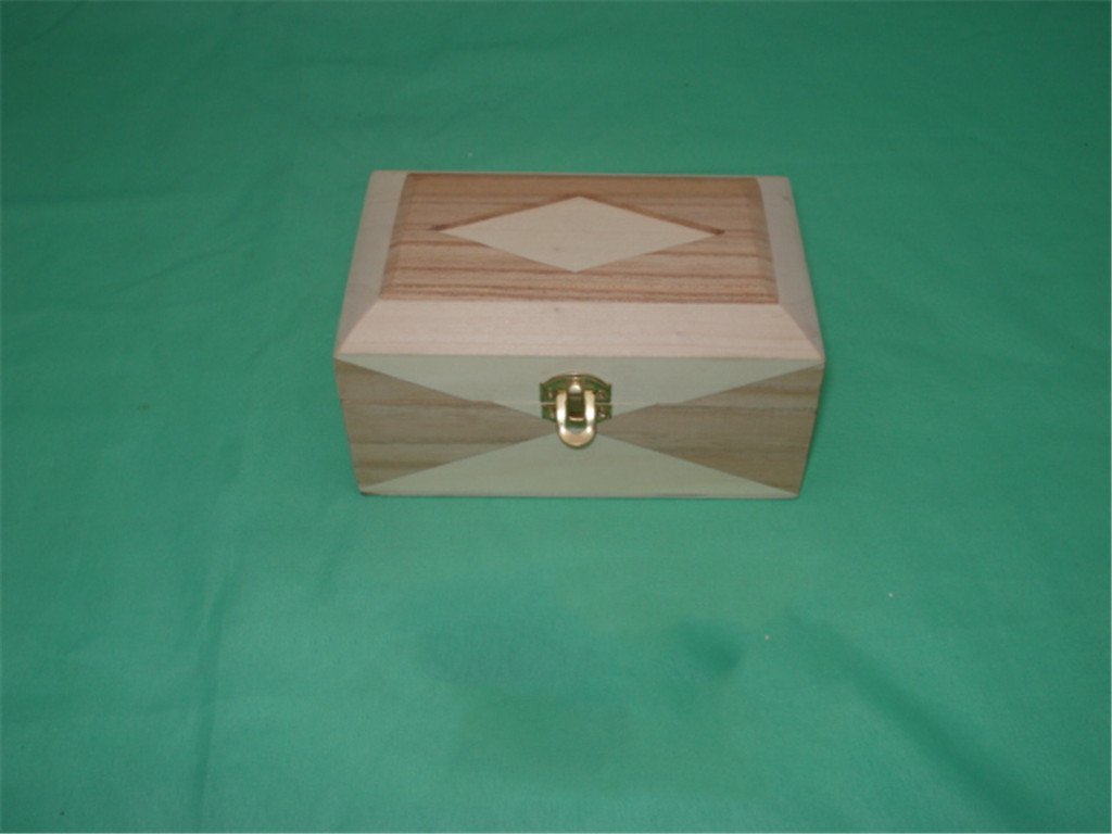 Square wooden box with diamond inlay pattern on lid and X-pattern on front, gold latch