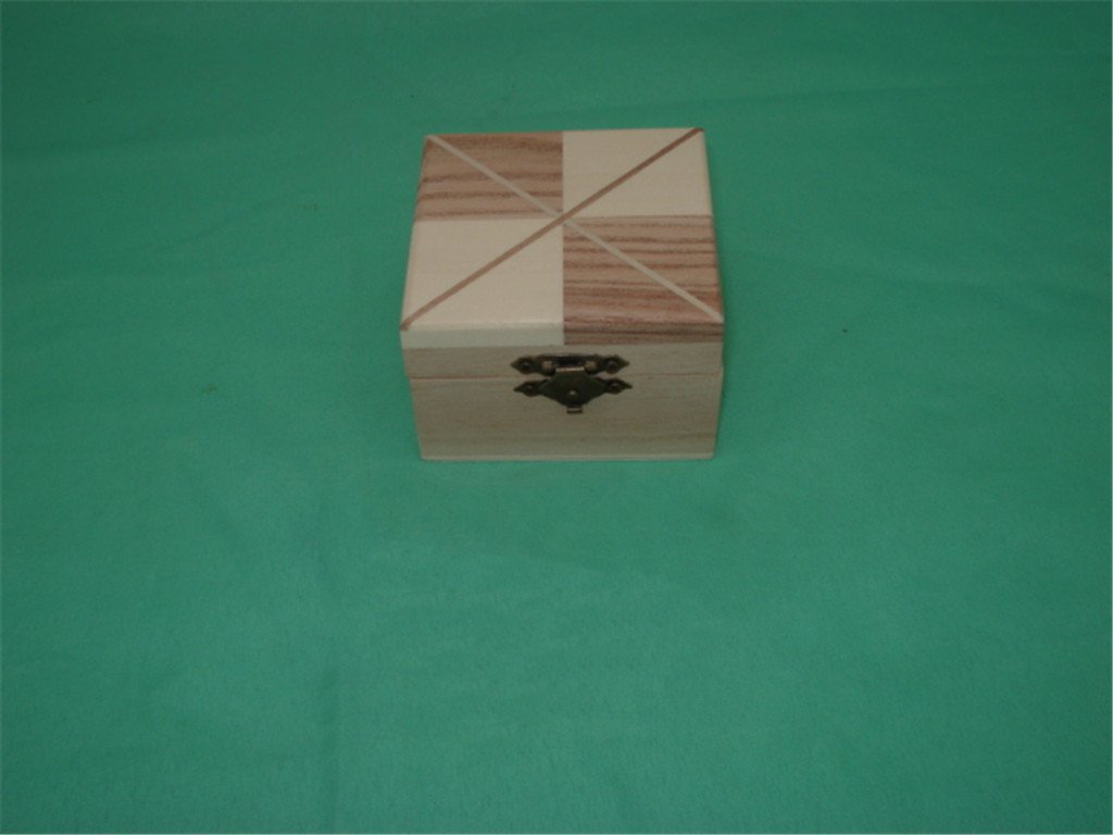 Small square wooden box with four-triangle quadrant inlay pattern on lid and bronze latch