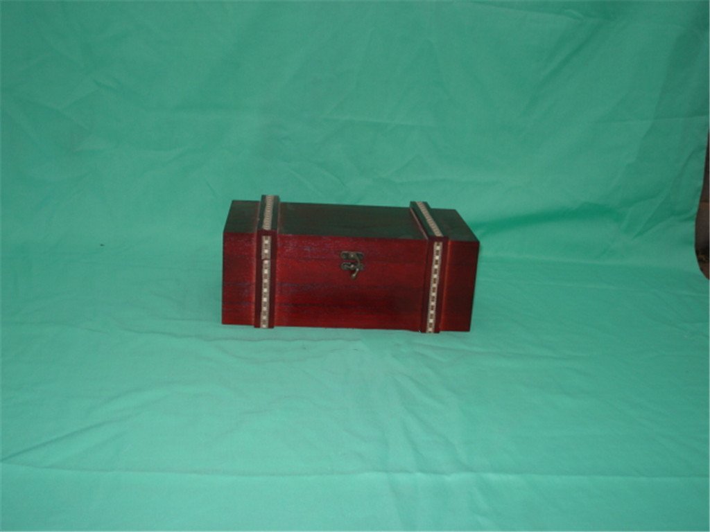 Long flat rectangular wooden box in red finish with two decorative bands and small metal clasp