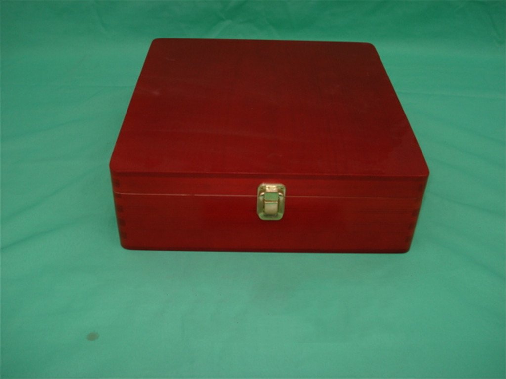 Square red lacquered wooden jewelry box with gold latch and red felt-lined interior compartments