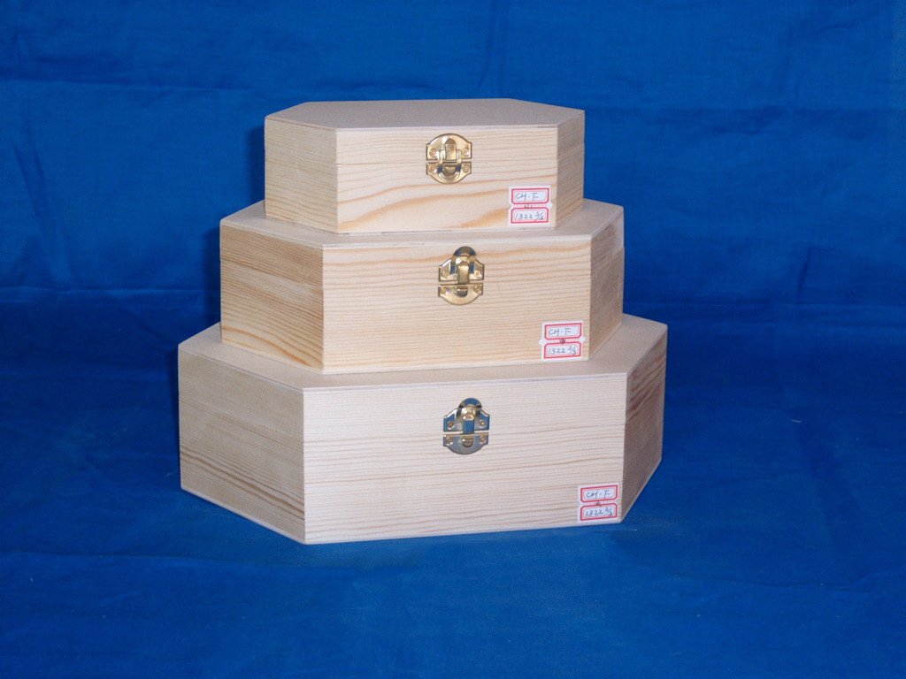 Three-tier nested hexagonal wooden box set in unfinished natural pine with brass latches and product labels