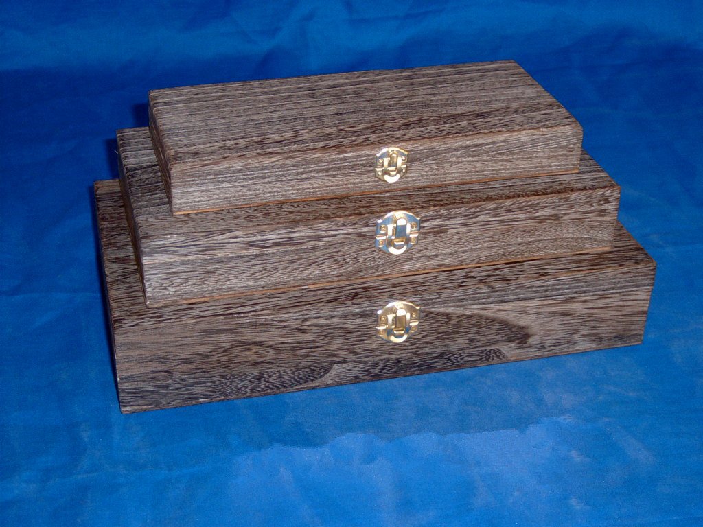 Three-tier nested rectangular wooden box set in driftwood finish with brass latches