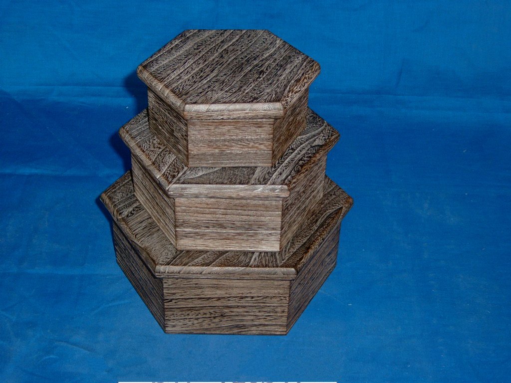 Three-tier nested hexagonal wooden box set in driftwood finish, no visible hardware