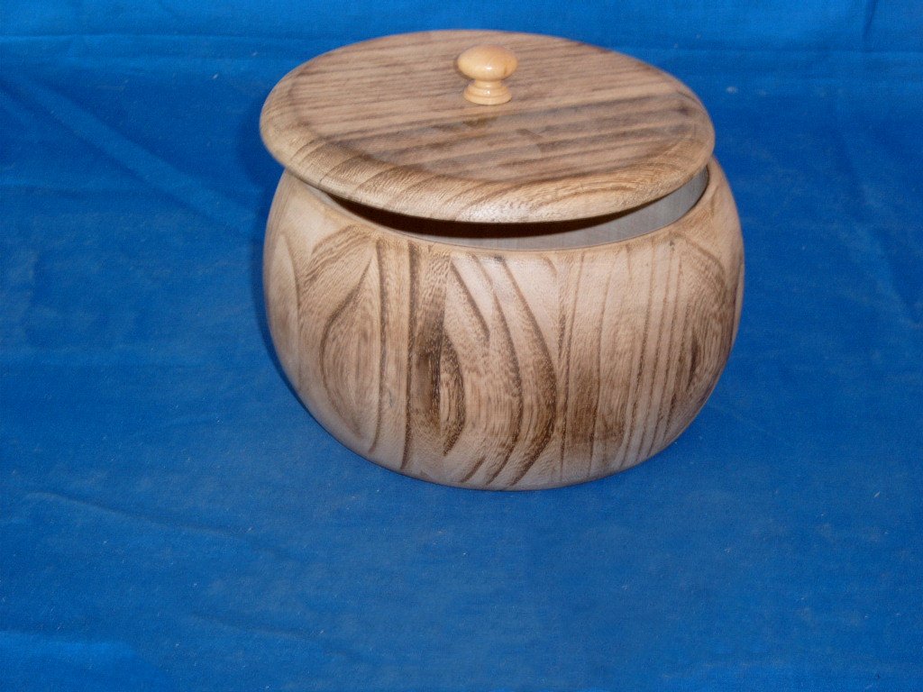 Round natural-wood barrel-shaped wooden box with removable lid and small round wooden knob