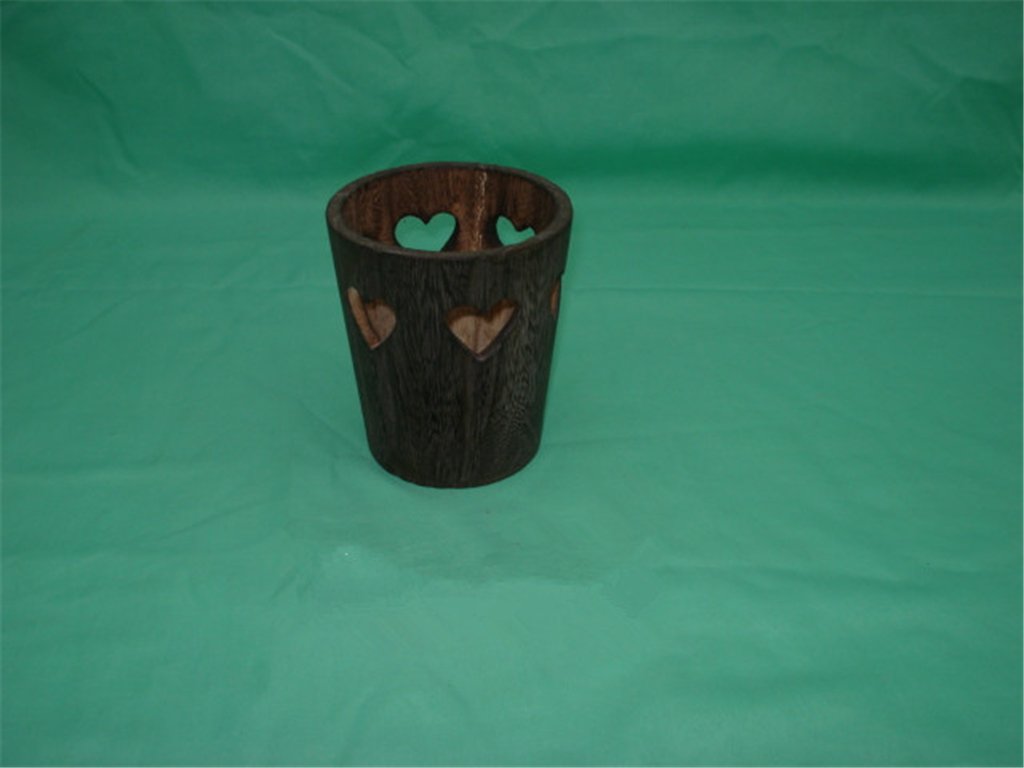 Round dark-wood flower pot with decorative heart cutout pattern