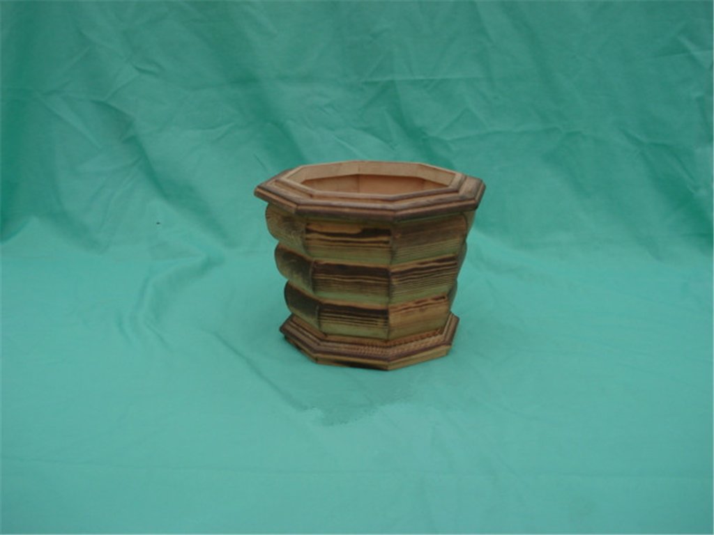 Small hexagonal light-wood flower pot with scalloped stacked design