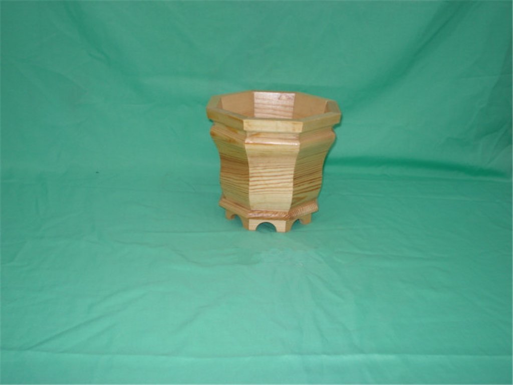 Small hexagonal light-wood flower pot with stepped design and small feet