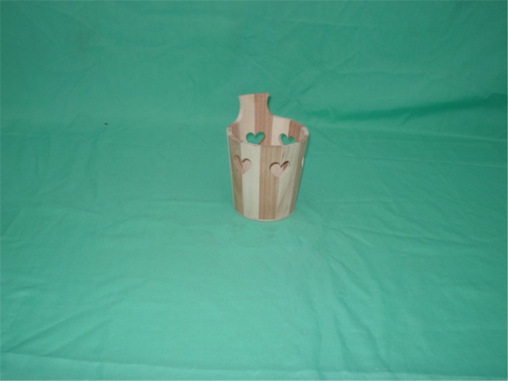 Cylindrical light-wood flower pot with heart-shaped cutouts