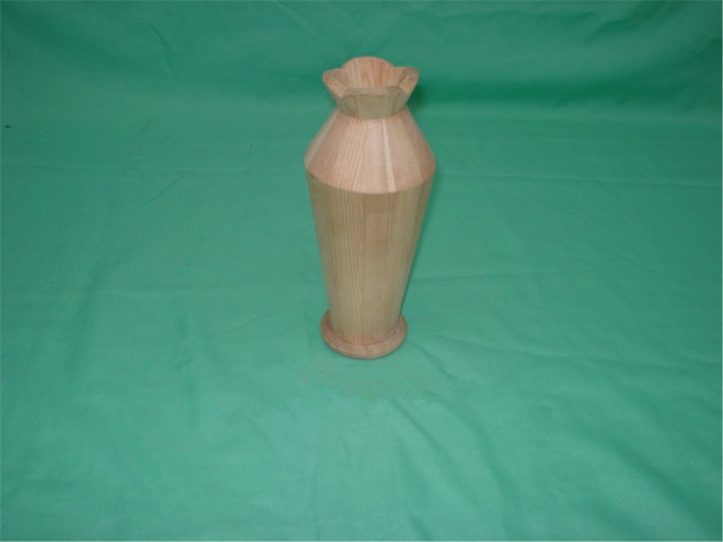 Tall slender natural-wood flower vase with scalloped flared top