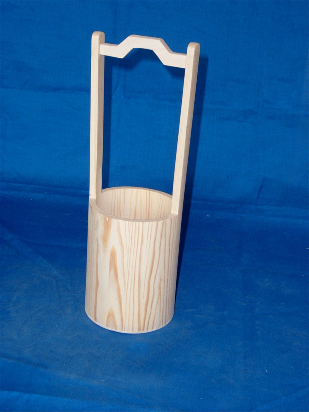 Tall cylindrical natural-wood wooden flower pot with tall decorative arch handle