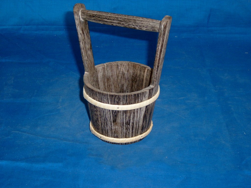 Round dark-stained wooden bucket flower pot with flat handle and metal bands