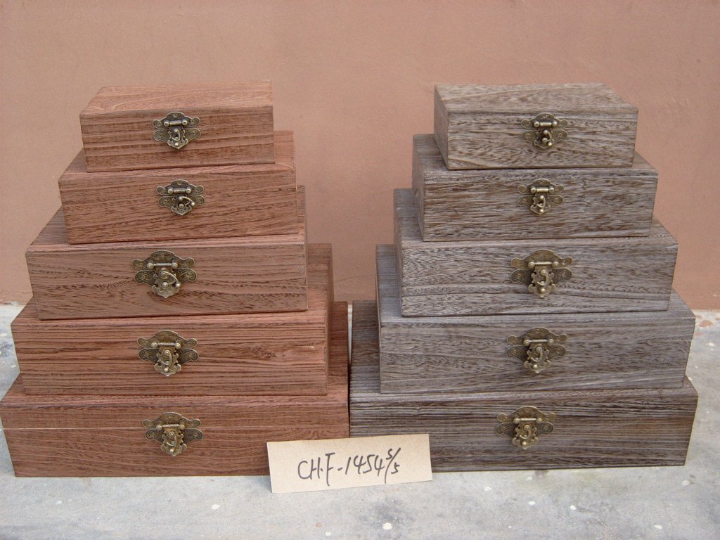 Five-step graduated wooden storage chest set in natural and dark ash finishes with brass latches