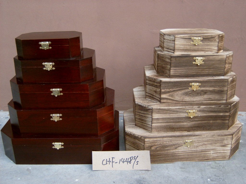 Five-tier octagonal wooden storage chest set in dark red and natural finishes with brass latches