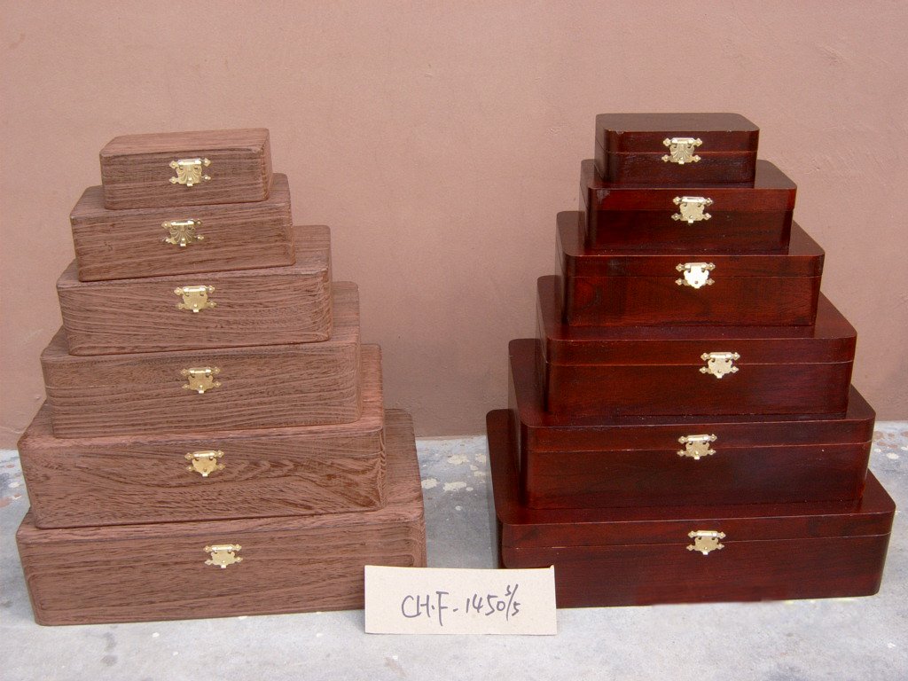 Five-step wooden storage chest set in medium brown and mahogany finishes with brass latches