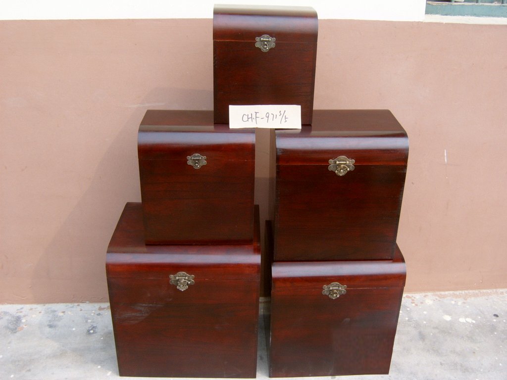 Five-piece glossy mahogany domed wooden storage chest set with brass latches