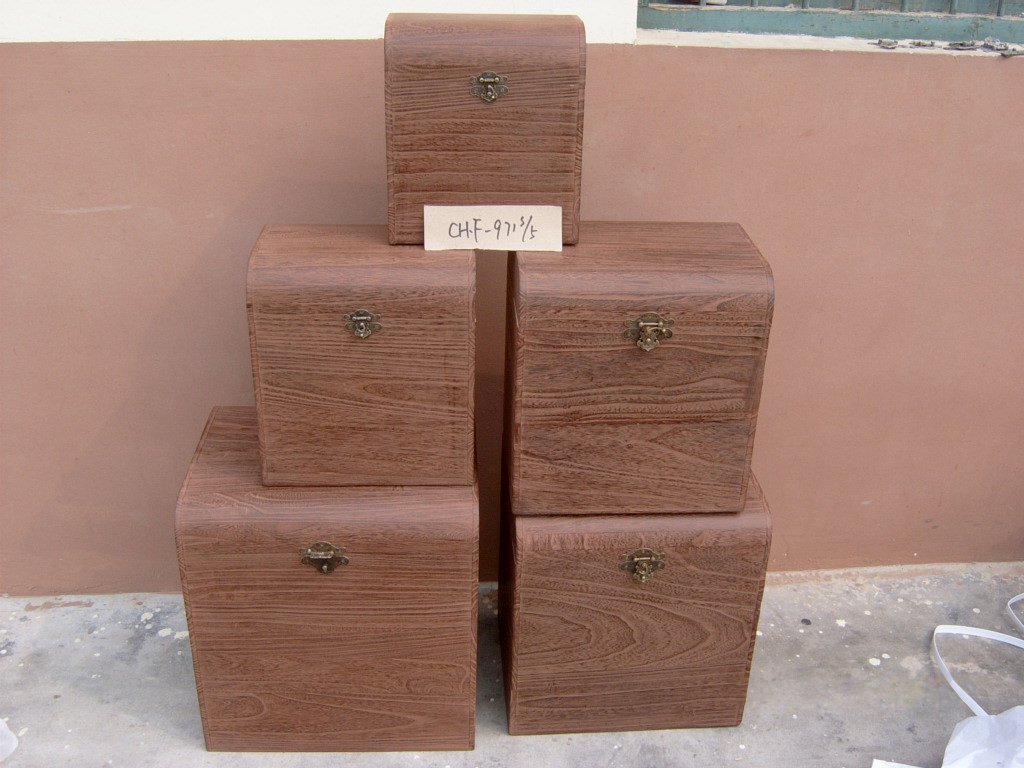 Five-piece medium-brown square wooden storage chest set with brass latches