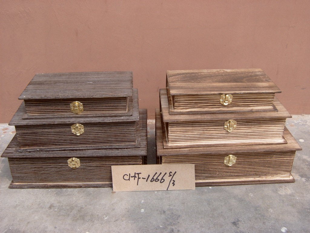 Three-piece ribbed wooden storage chest set in dark and natural finishes with gold latches