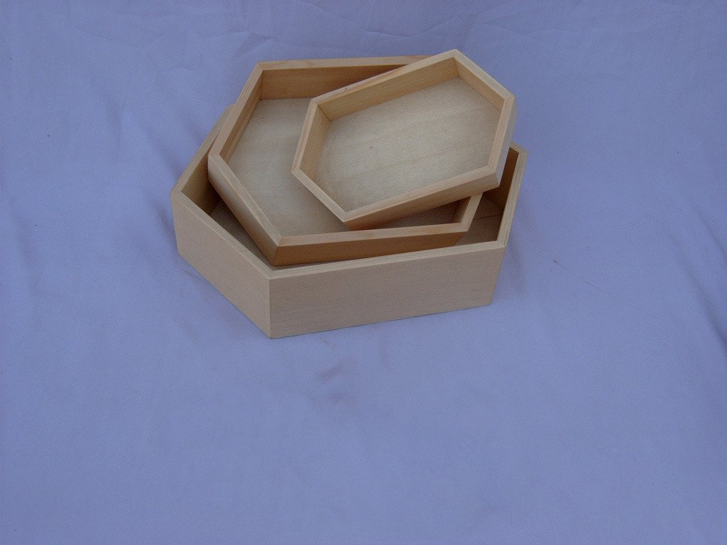Hexagonal wooden serving tray with fitted lid in natural wood finish