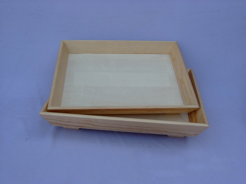 Set of two square wooden serving trays with raised rims in natural wood finish