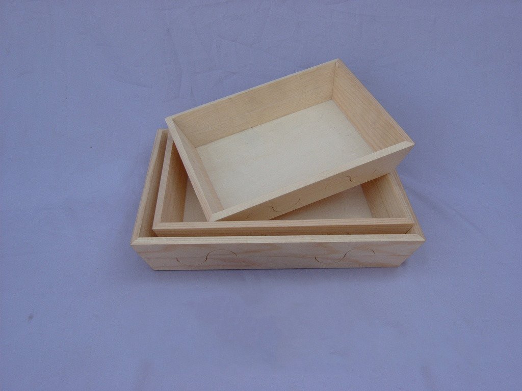 Set of two square wooden serving trays with carved scalloped edge and fitted lid