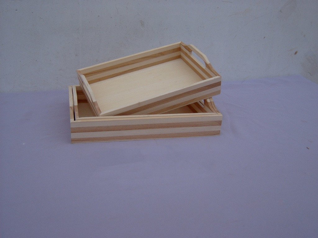 Set of two striped wooden serving trays with cutout side handles in natural and dark wood