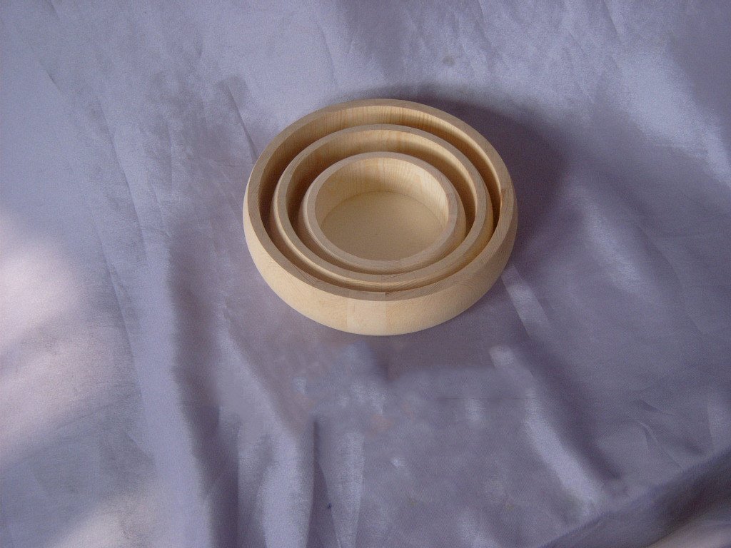 Set of three nested round wooden bowls / circular trays in natural wood finish