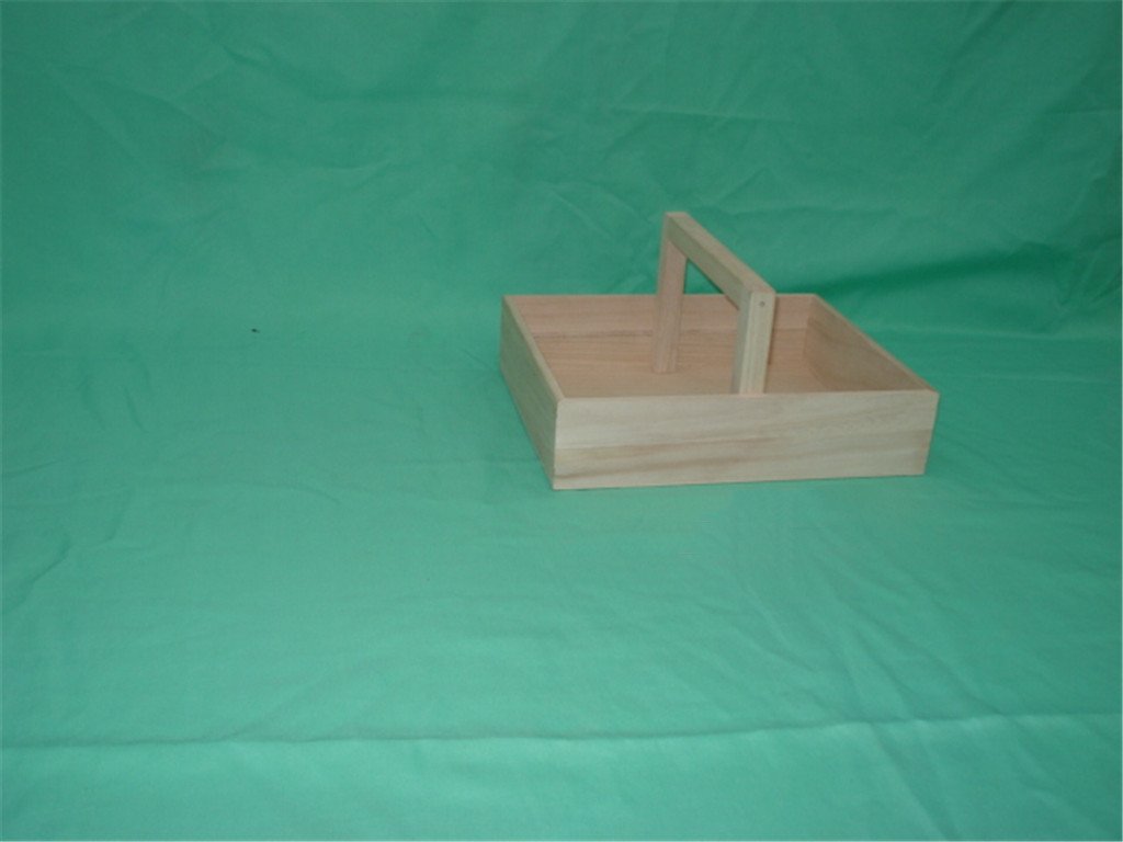 Small square wooden caddy with tall center handle, like a small carrier