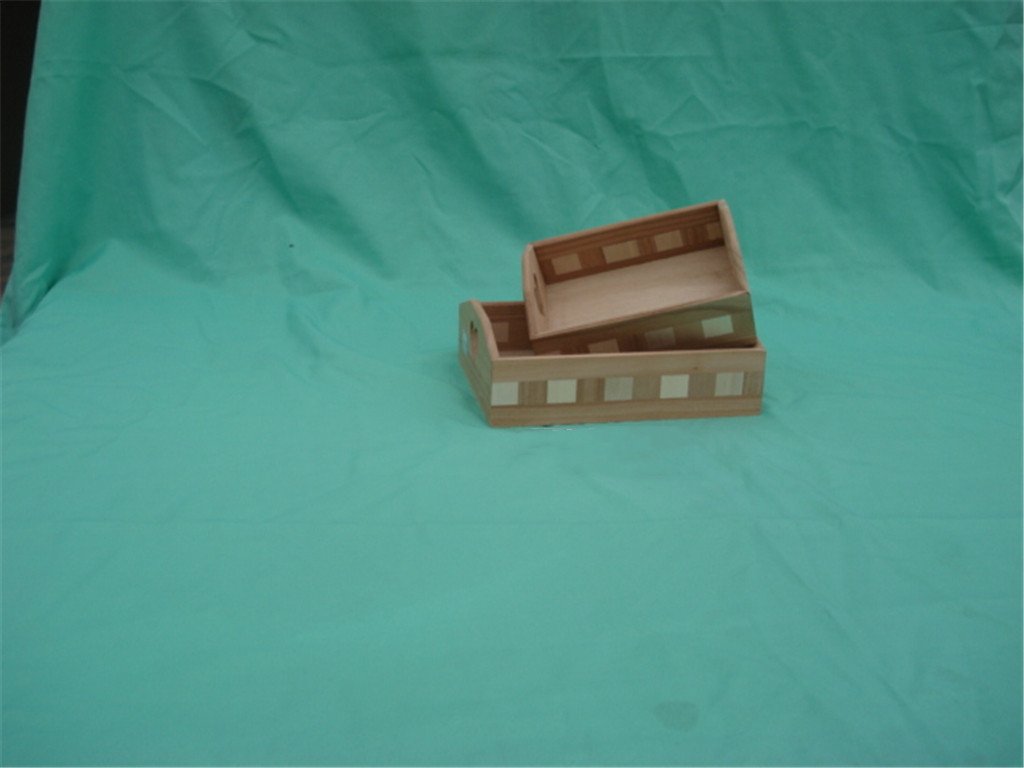 Set of two rectangular wooden serving trays in two-tone stripe design with side cutout handles