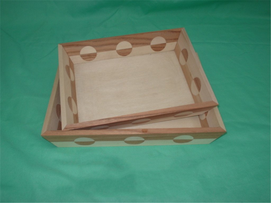 Set of two square wooden serving trays with circular cutout side handles and fitted lid
