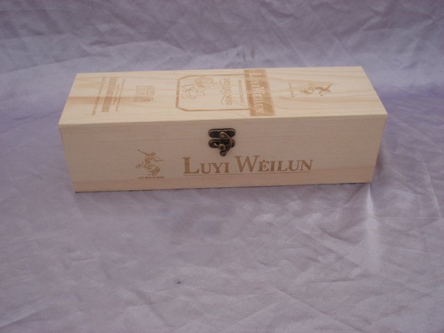 Long flat rectangular natural-pine wooden wine box with LUYI WEILUN engraved logo and grape illustration, brass latch