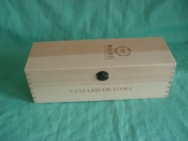 Long flat rectangular natural-pine wooden wine box with finger-jointed corners, VATS LIQUOR STORE engraved text and dark latch