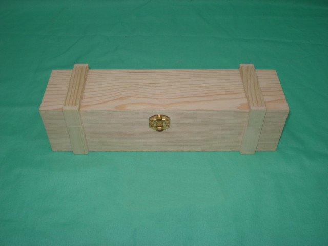 Long flat rectangular natural-pine wooden wine box with finger-jointed corners and brass latch