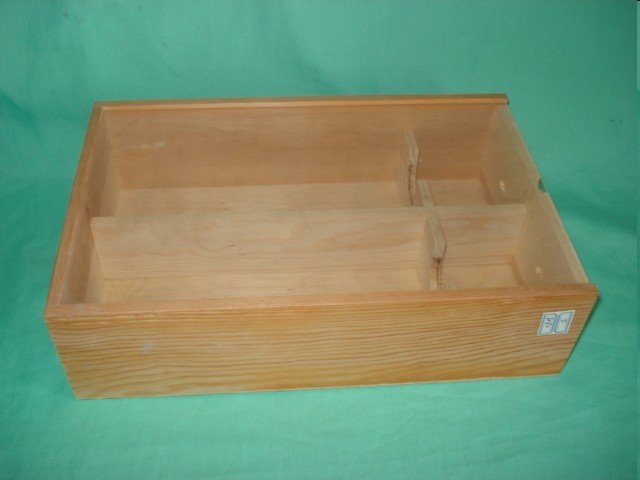 Long flat natural-pine wooden wine box with three internal bottle divider slots and finger-jointed corners
